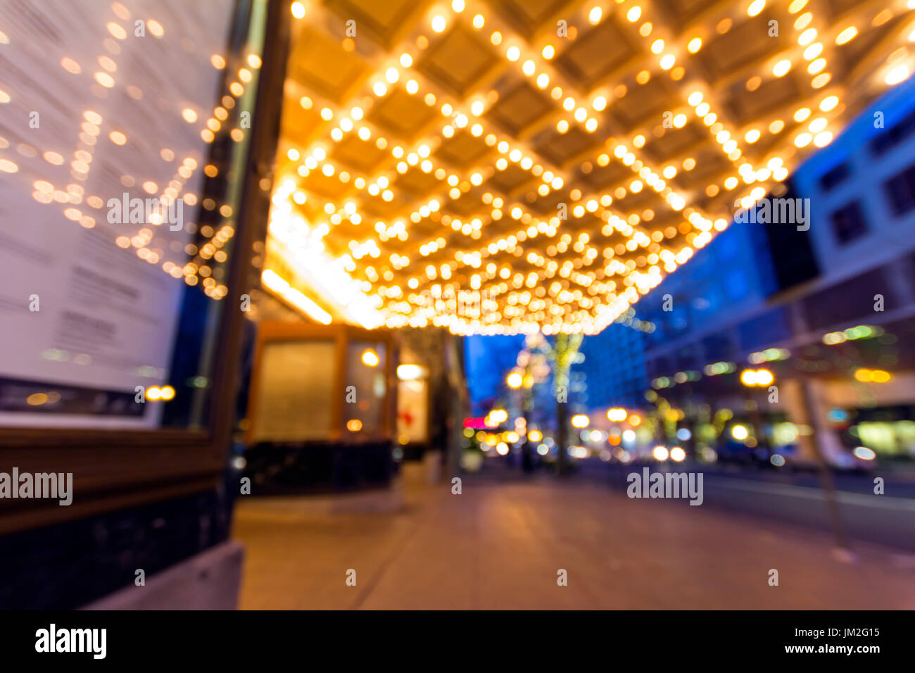 Portland Oregon Downtown Entertainment and Shopping District at Evening Blue Hour with Marquee and Traffic Lights Blurred Bokeh Background Stock Photo