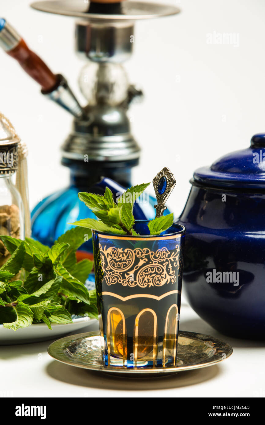 Traditional Arab mint tea in a traditional cup with mint leaves Stock