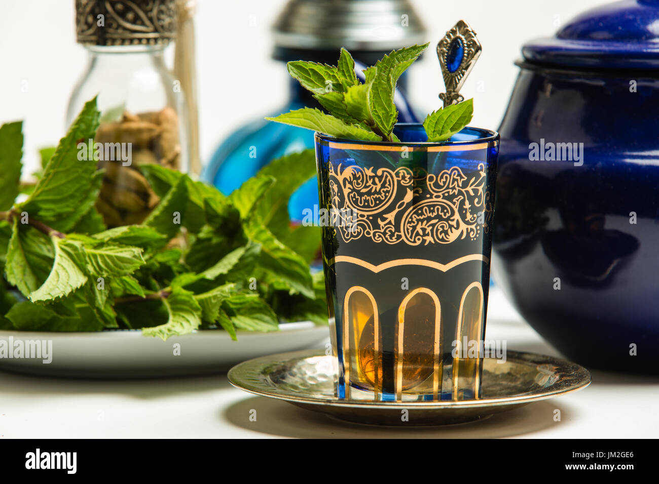 Traditional Arab mint tea in a traditional cup with mint leaves Stock