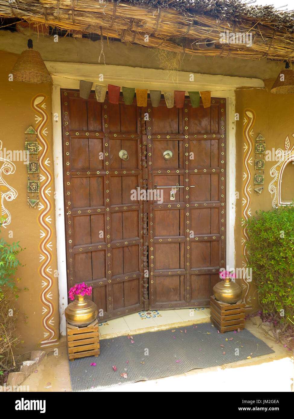 Front door, carve of hard wood in India, for protection of Elephants and others. Stock Photo