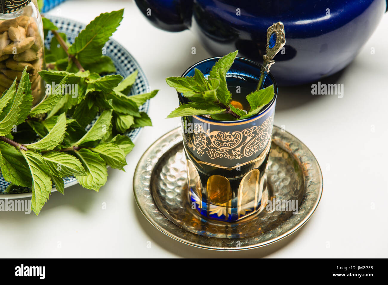 Traditional Arab mint tea in a traditional cup with mint leaves Stock