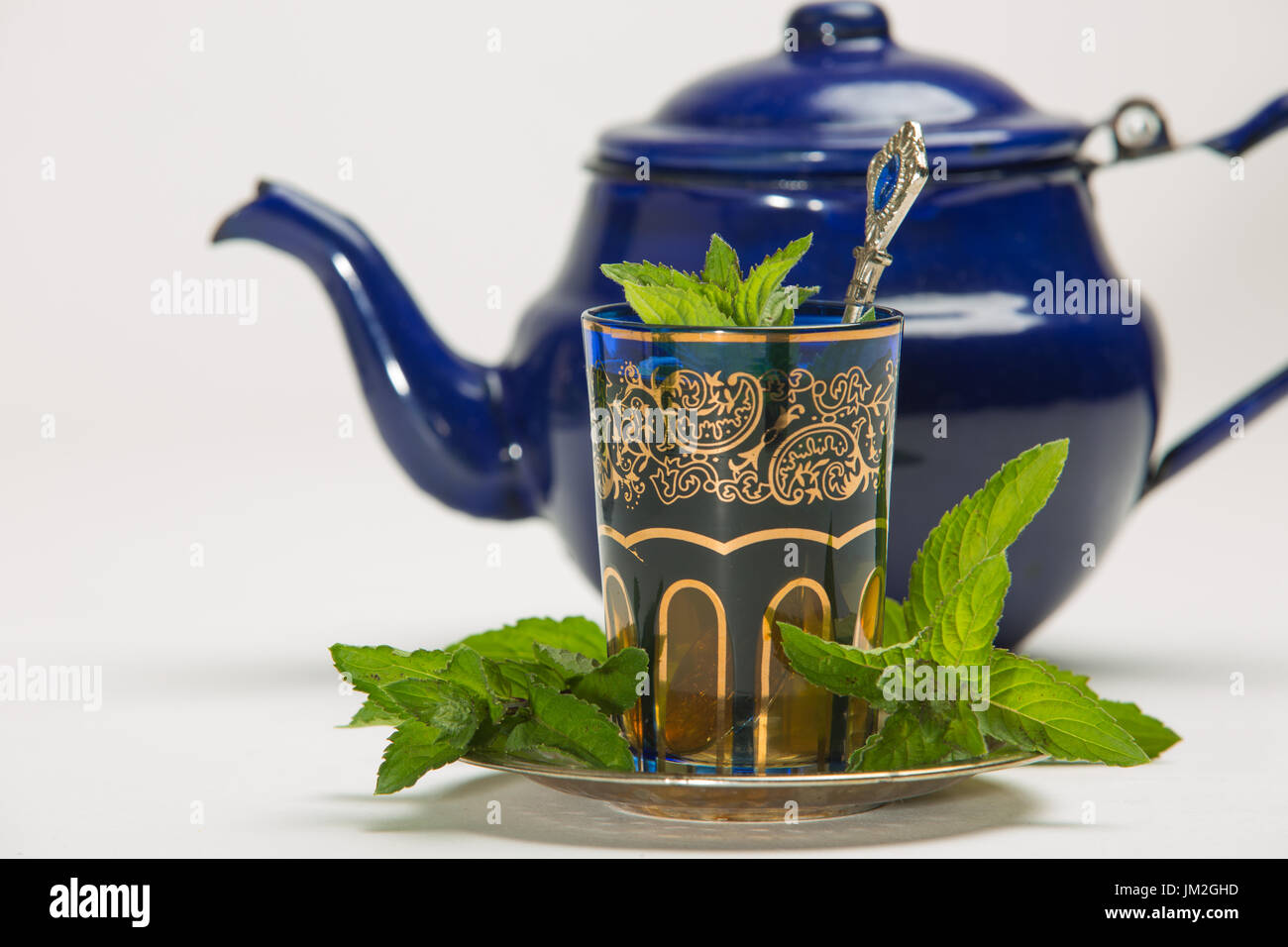 Traditional Arab mint tea in a traditional cup with mint leaves Stock