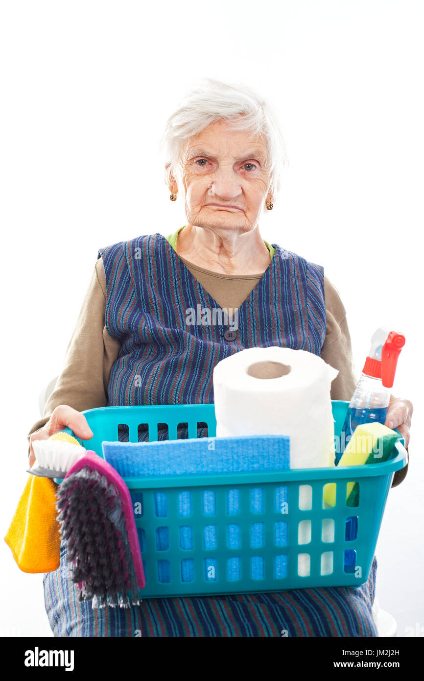 Portrait of a happy senior lady doing housework holding cleaning equipment Stock Photo Alamy