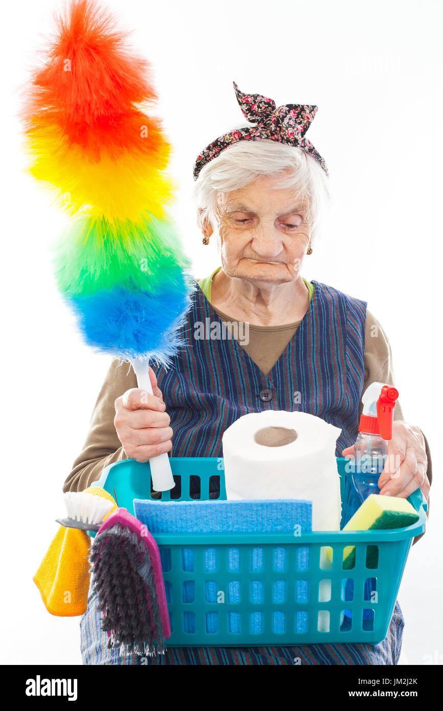 Portrait of a happy senior lady doing housework holding cleaning equipment Stock Photo Alamy