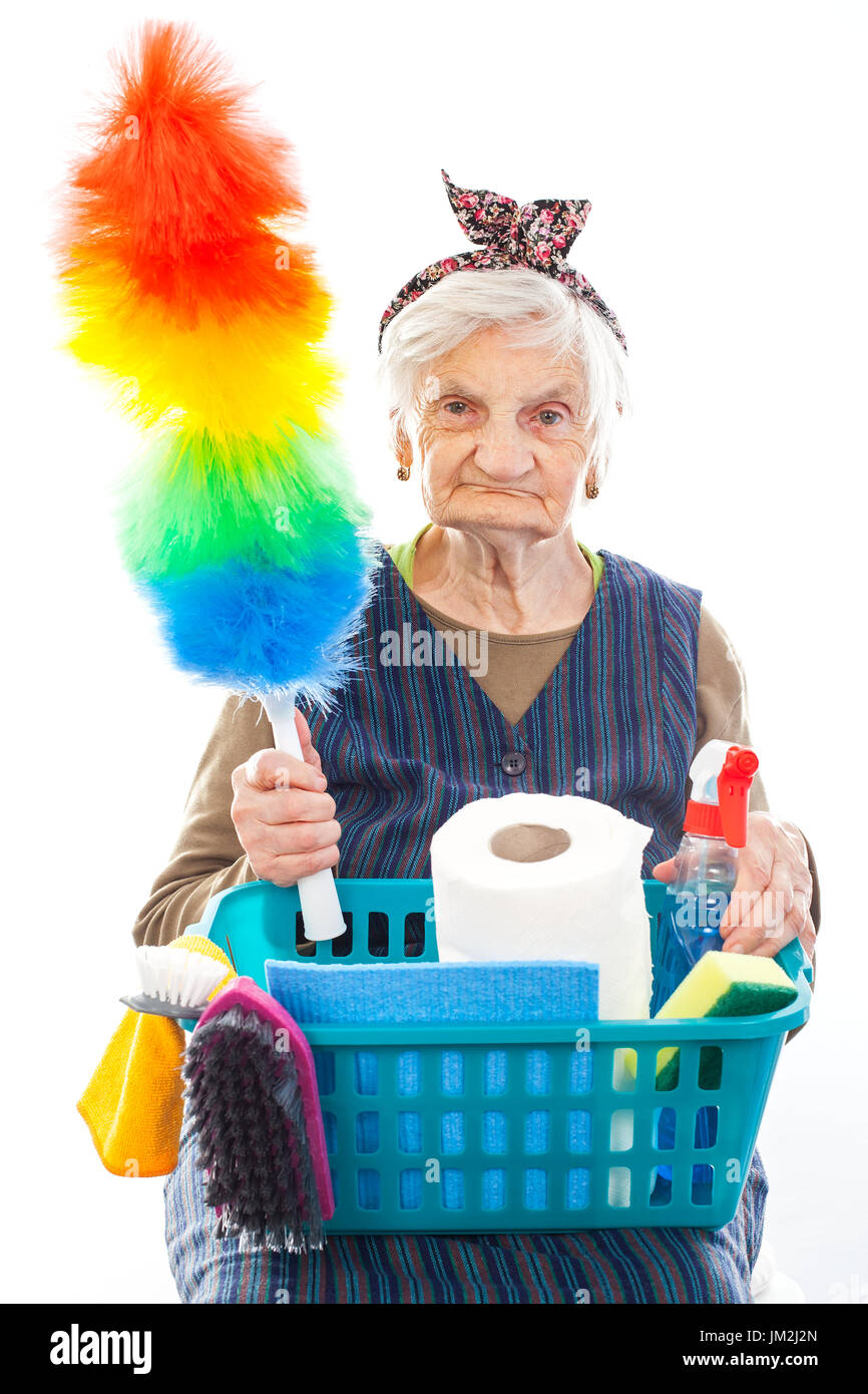 Portrait of a happy senior lady doing housework holding cleaning