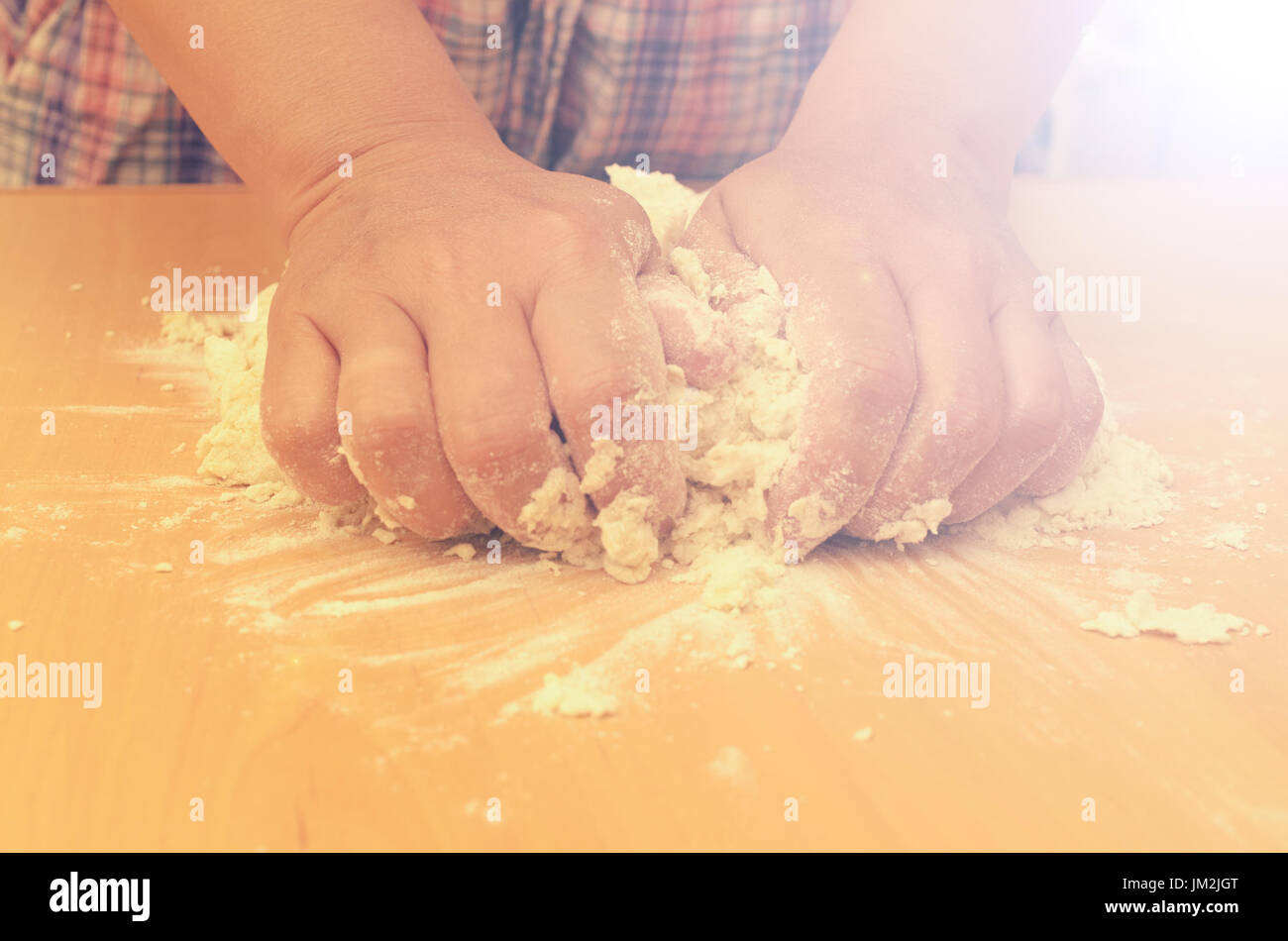 A woman kneads a homemade dough for pizza production Stock Photo - Alamy