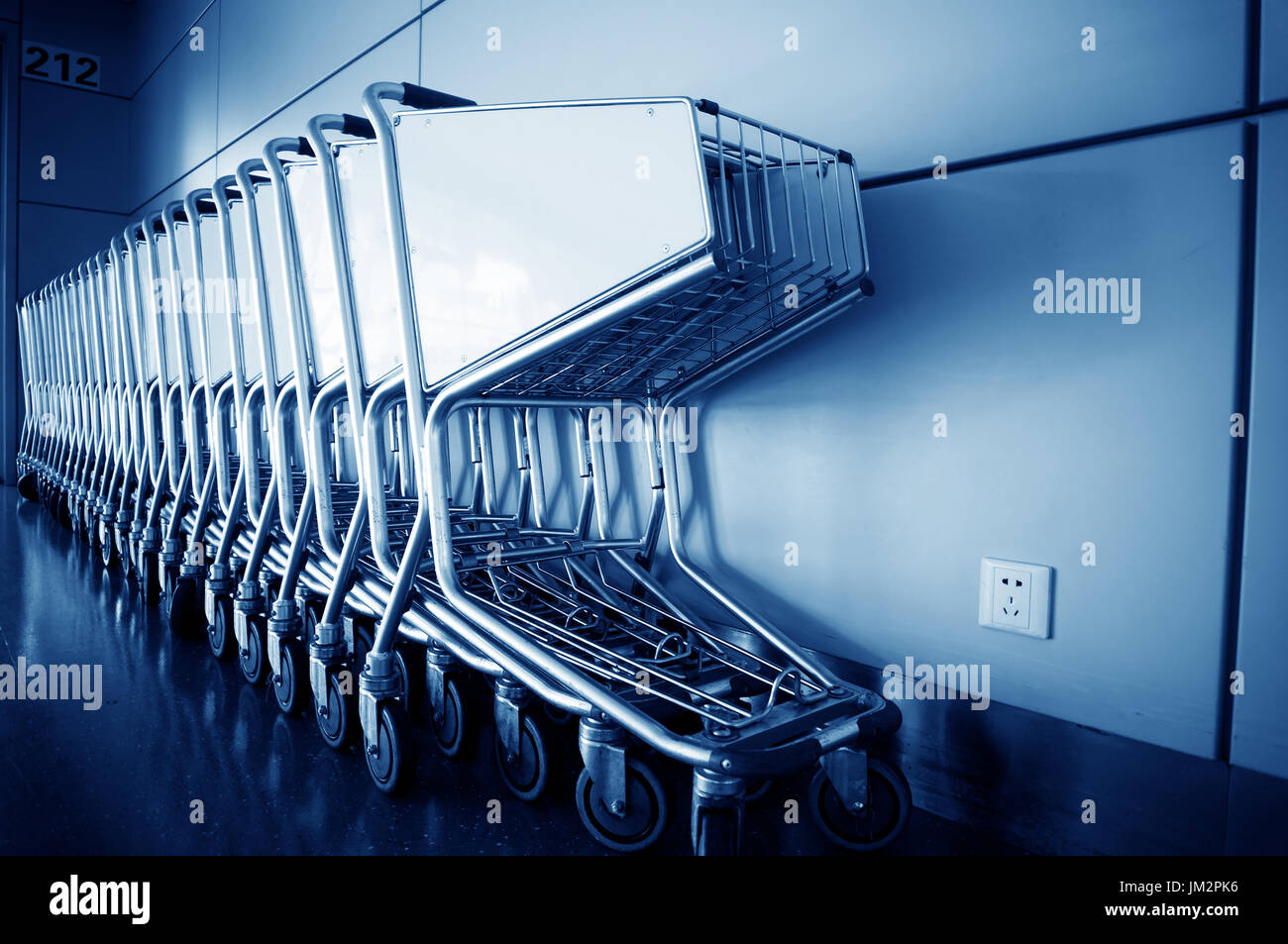 Luggage carts inside modern international airport Stock Photo Alamy