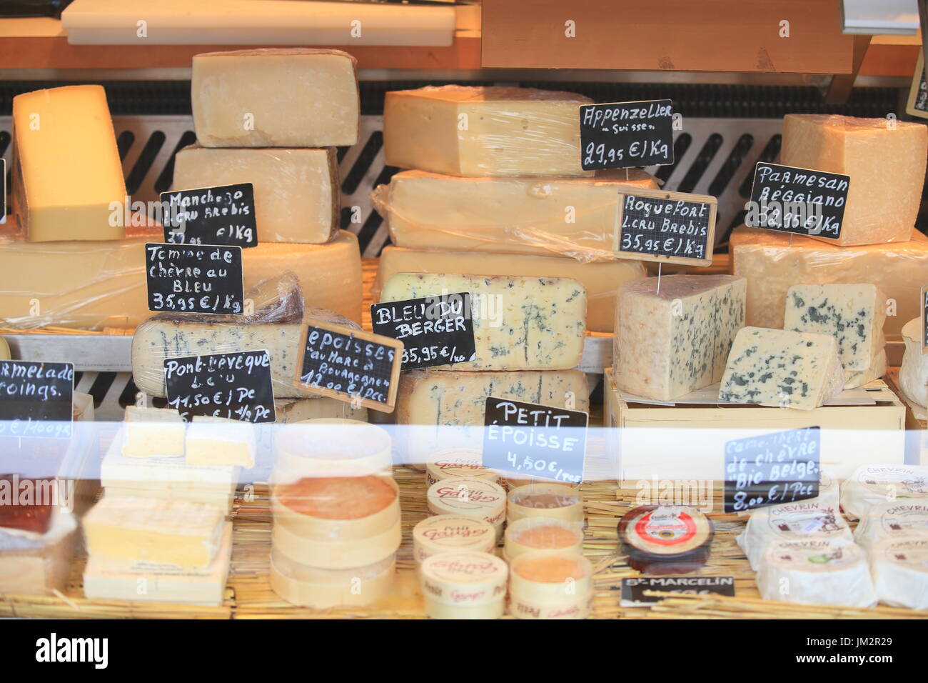 Brussel, Belgium - July 16, 2017: Many sorts of cheese on storefront. Food sales theme. Stock Photo