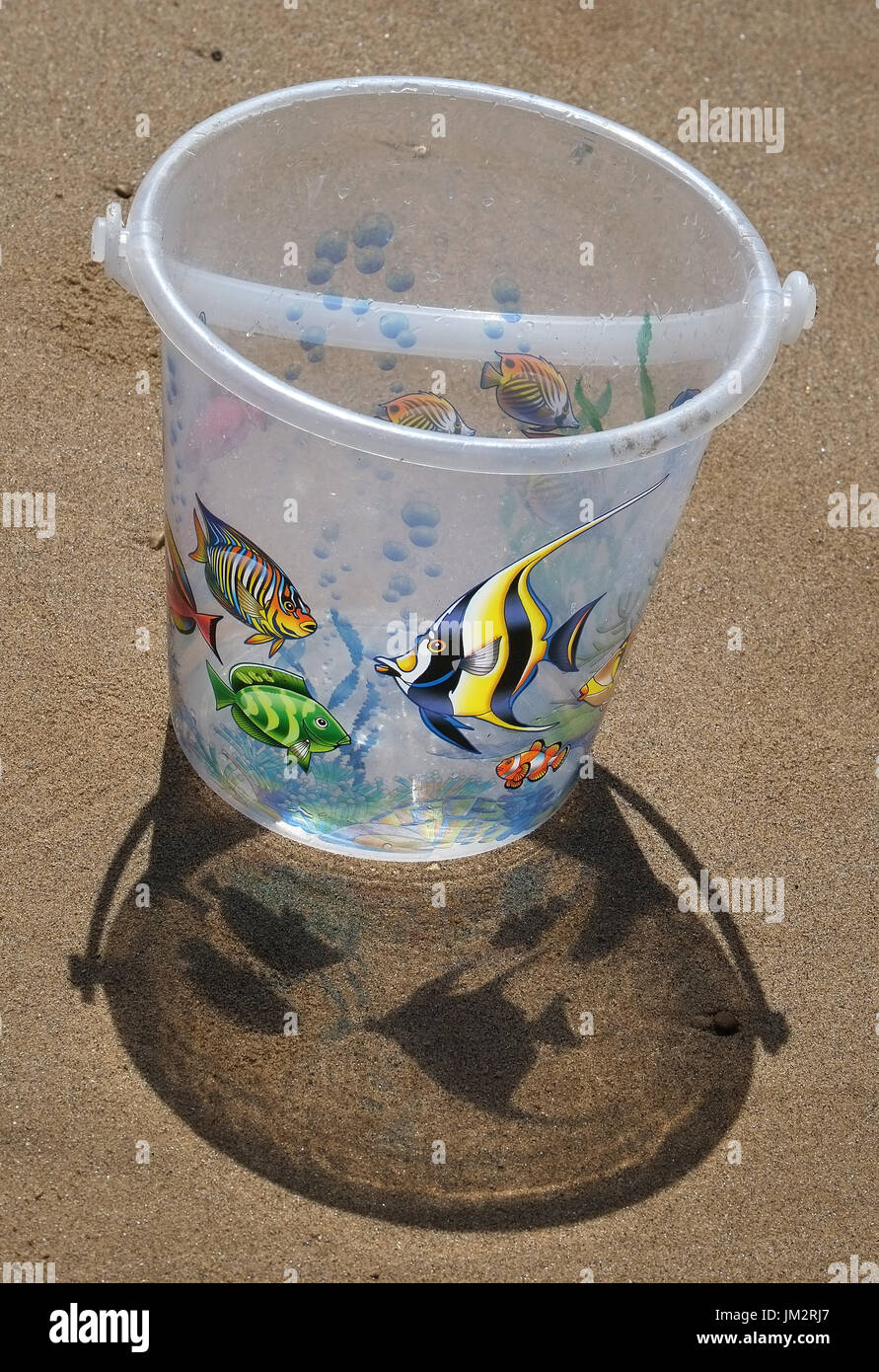 Child's Bucket in the sun with shadows. Stock Photo