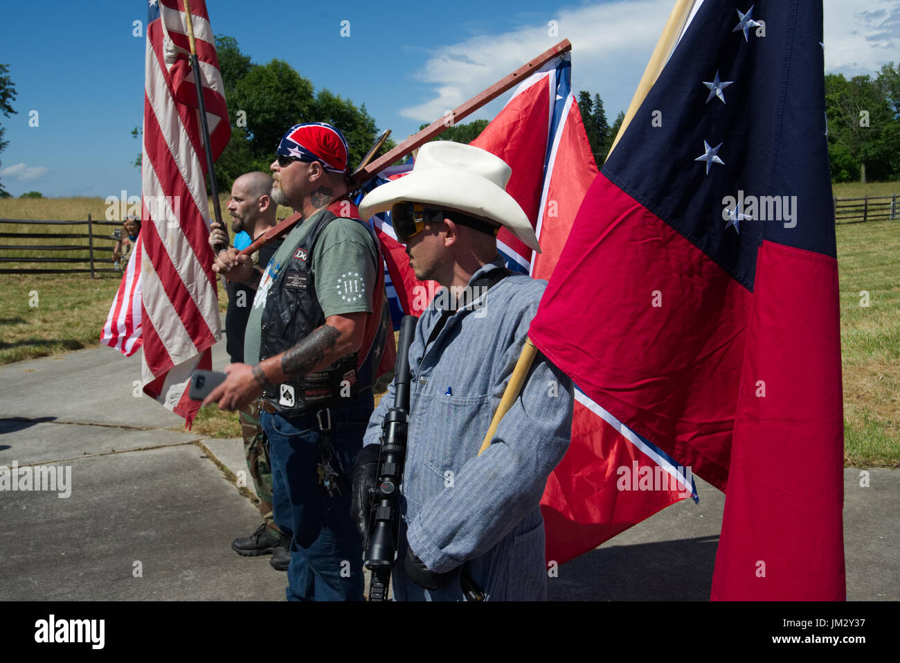 Participants carry American and Confederate flags during a patriotic free speech rally at Gettysburg National Military Park in Gettysburg, PA Stock Photo