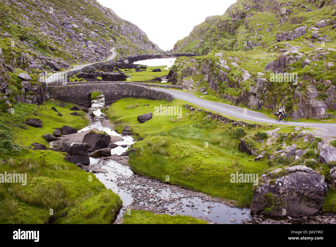 Cycling up the Gap of Dunloe in County Kerry, Ireland Stock Photo