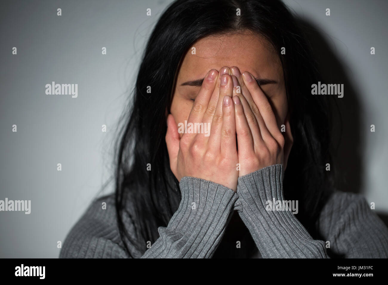 close up of unhappy crying woman Stock Photo