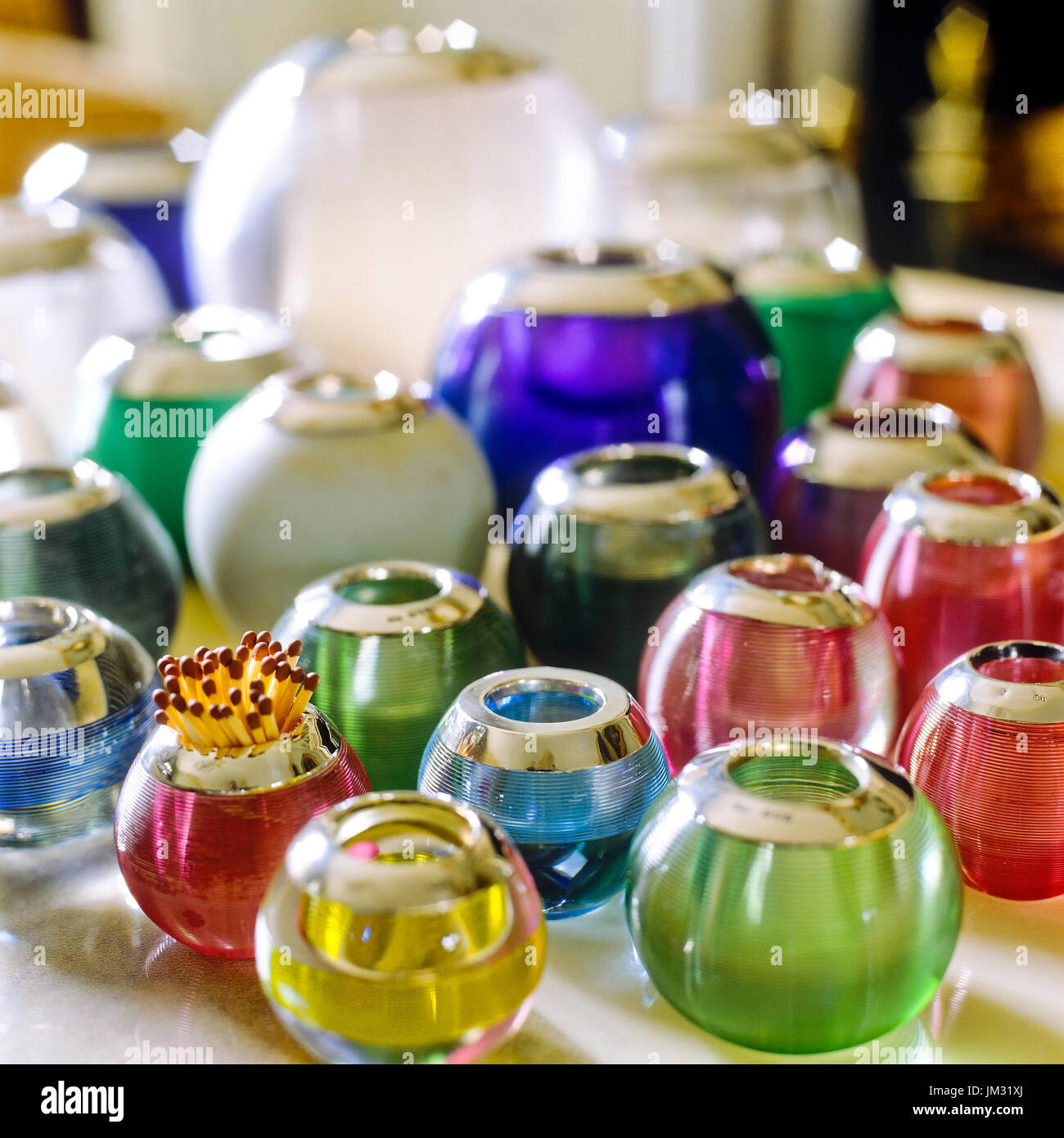 Collection of vibrant candle holders Stock Photo