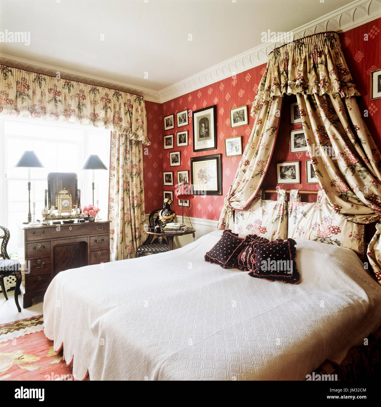 Canopy bed with floral patterns Stock Photo Alamy