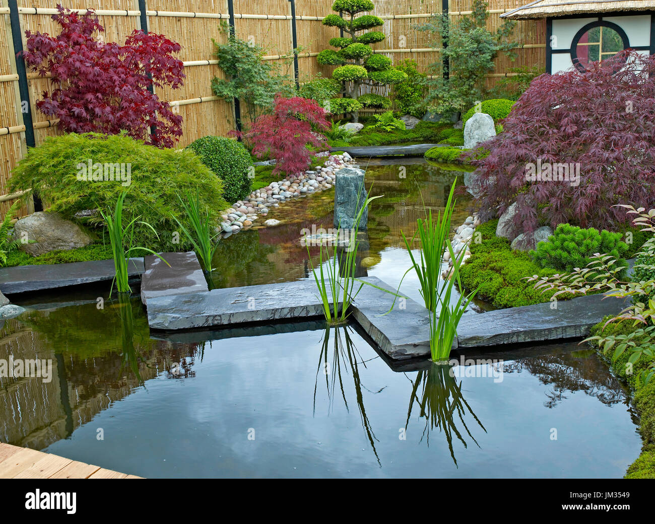Garden in the style of a Japanese Tea Garden with traditional planting Stock Photo