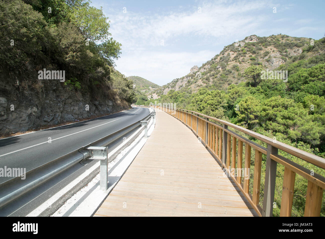 a curving road into nature near Benahavis, Spain Stock Photo