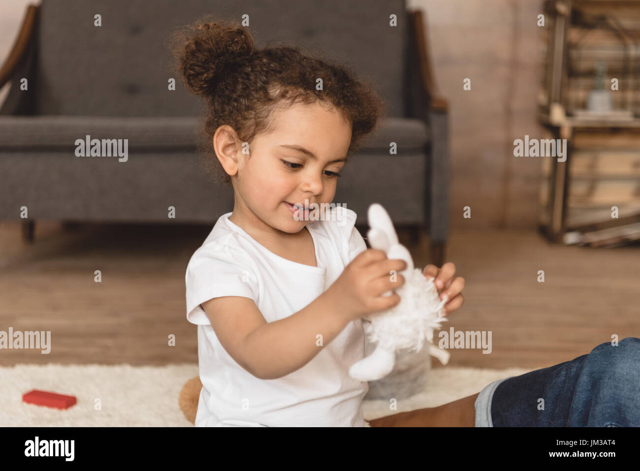 cute little kid girl playing with toy at home Stock Photo - Alamy