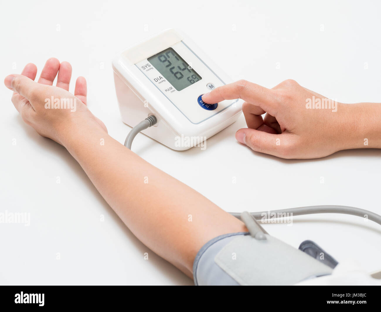 measuring blood pressure with digital equipment Stock Photo