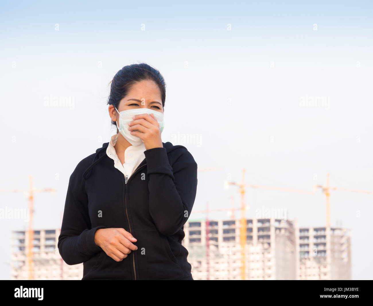 asian woman wearing face mask and coughing by pollution Stock Photo - Alamy