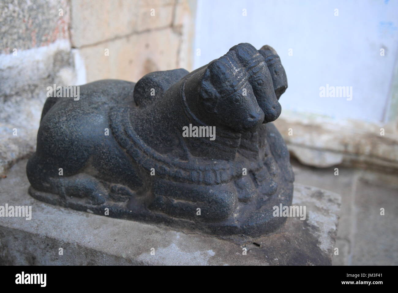 Three headed black stone Nandi bull statue at Virupaksha temple, Hampi