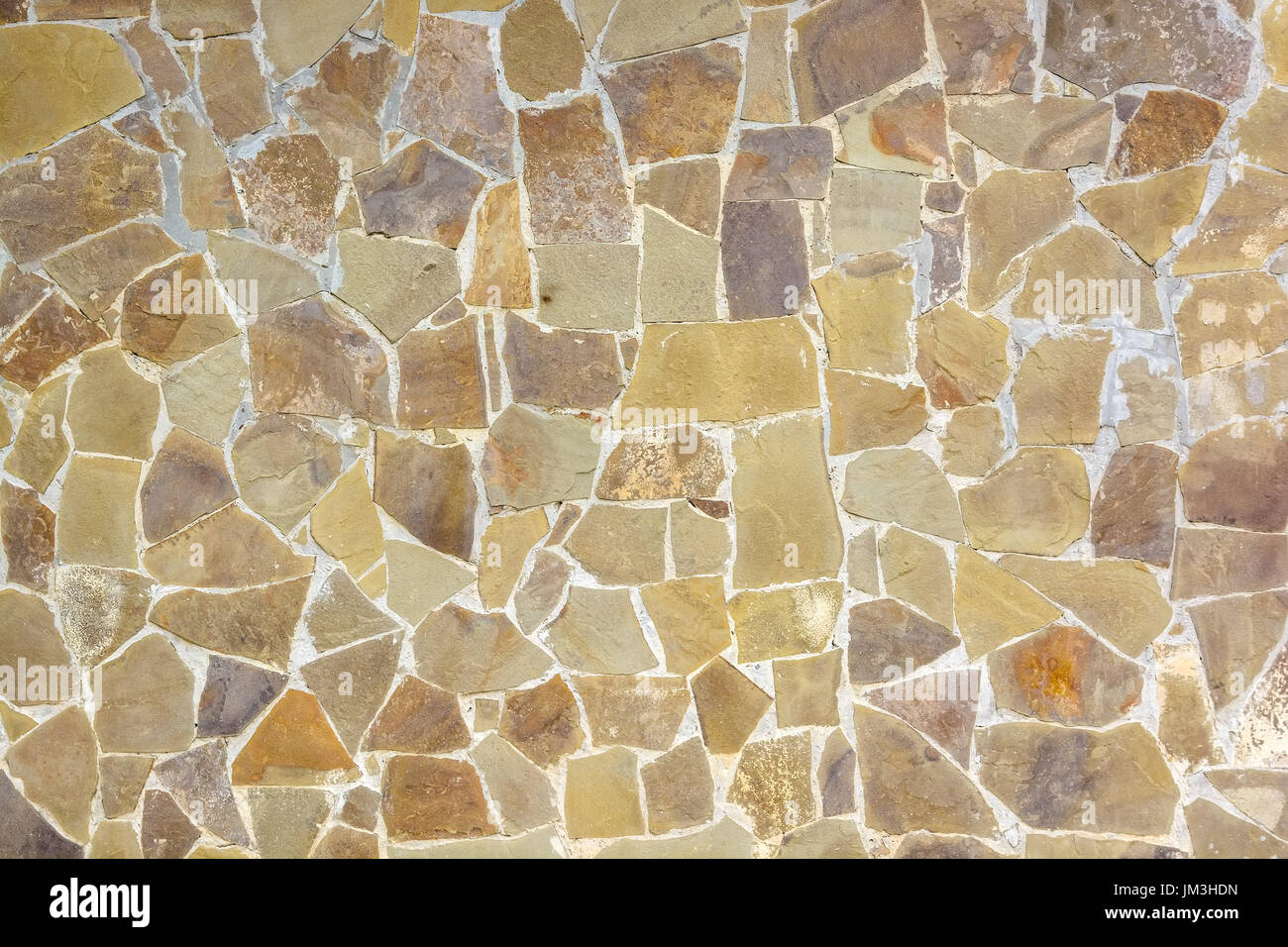 Closeup of beige rough uneven actique stone wall Stock Photo - Alamy