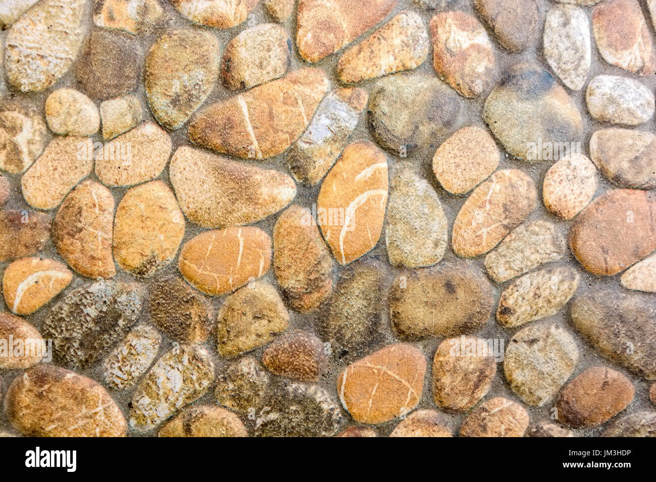 Closeup of beige rough uneven actique stone wall Stock Photo - Alamy