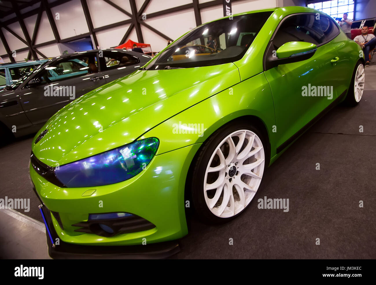 SAINT-PETERSBURG, RUSSIA - JULE 23, 2017: Front view of green car Wolkswagen with sport tuning on Royal Auto Show. Close up of Car hood and white whee Stock Photo