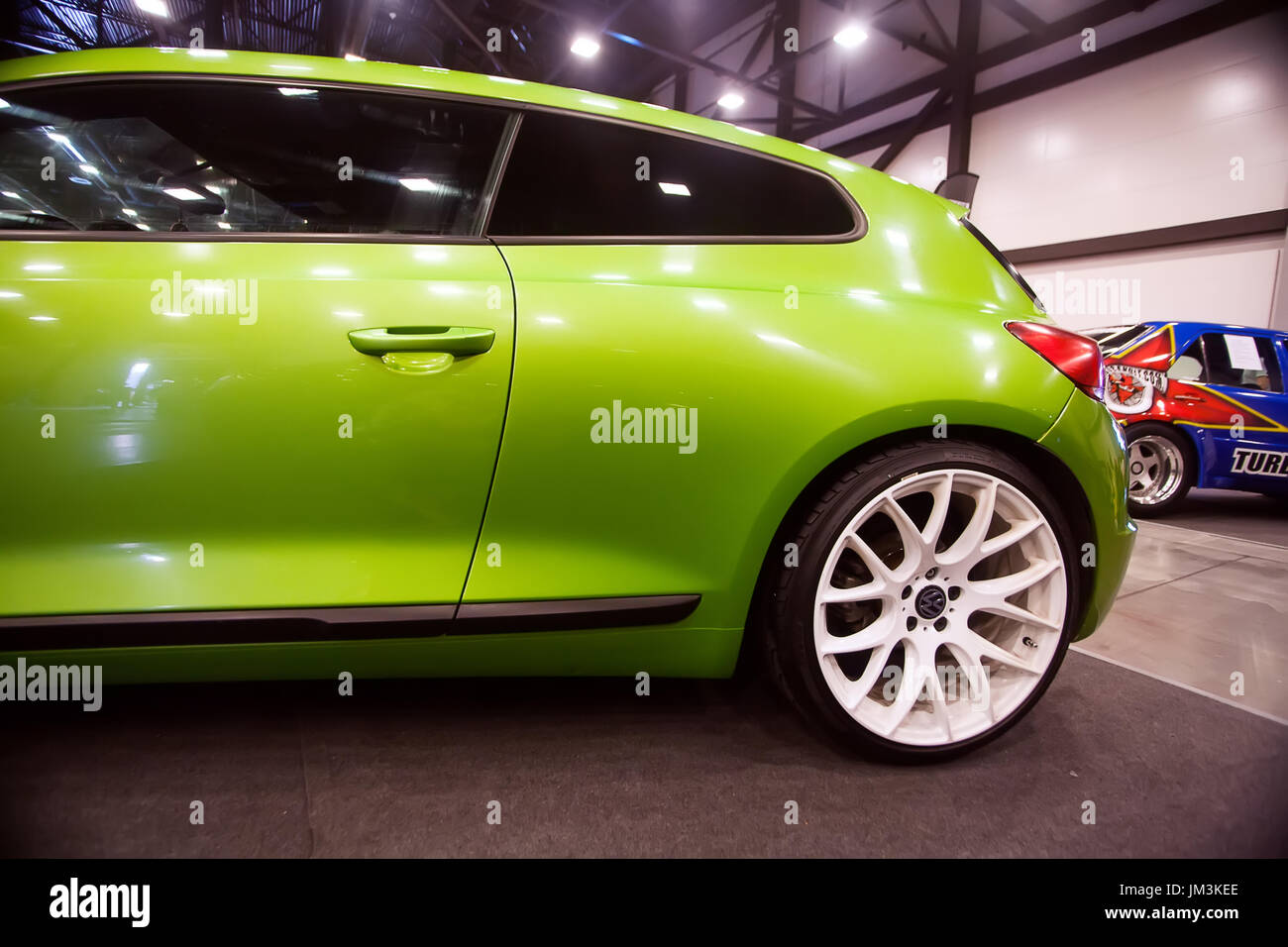 SAINT-PETERSBURG, RUSSIA - JULE 23, 2017: Front view of green car Wolkswagen with sport tuning on Royal Auto Show. Close up of Car side and white whee Stock Photo