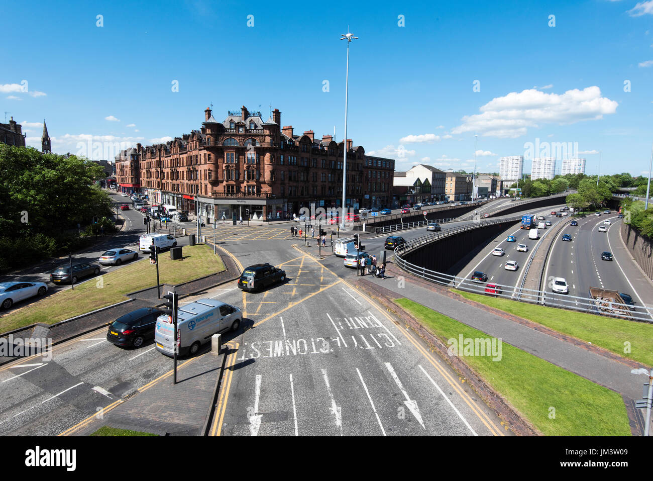 View of busy road junction in Charing Cross area of Glasgow in city centre. Stock Photo