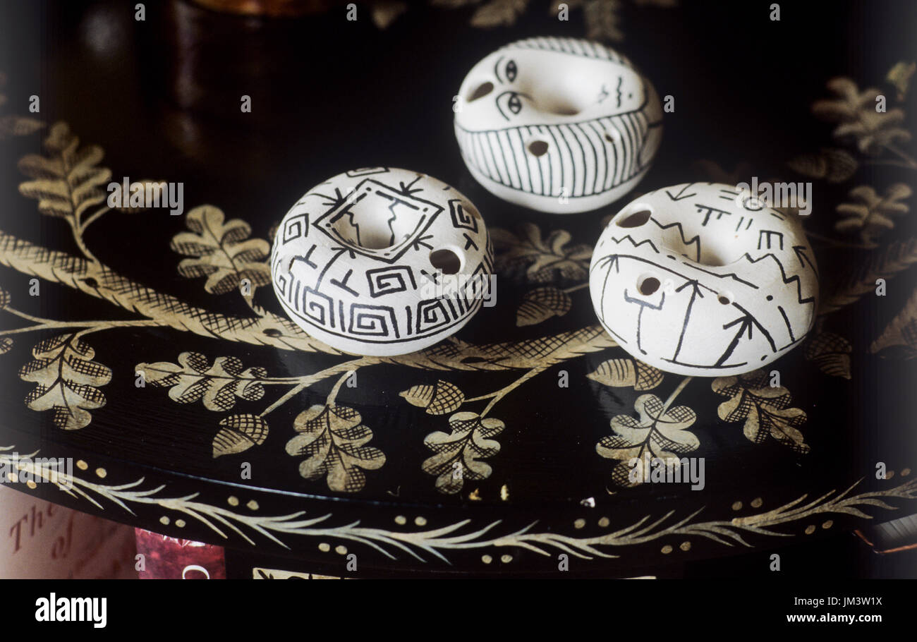Monochrome circular ornaments on table Stock Photo