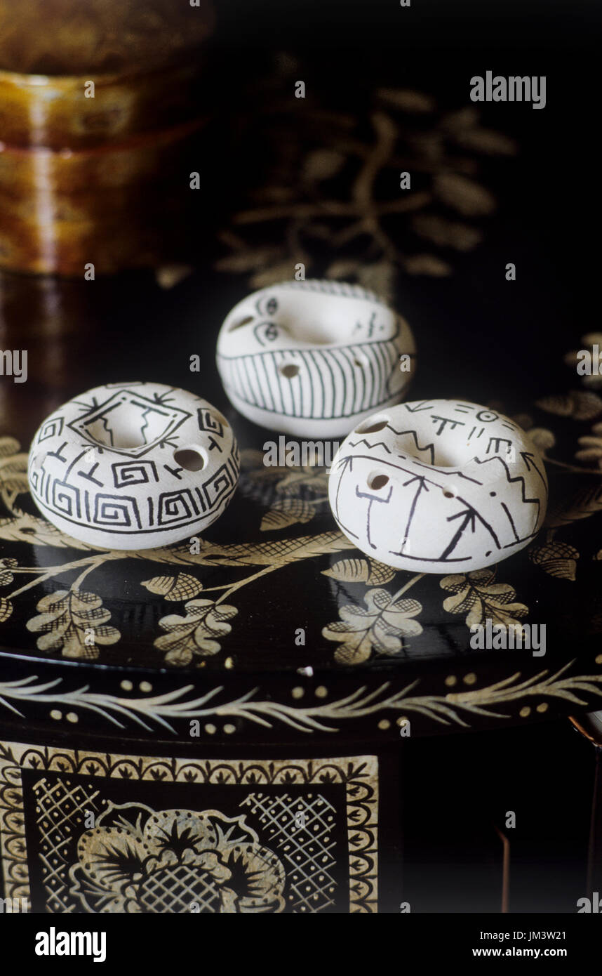 Monochrome circular ornaments on table Stock Photo