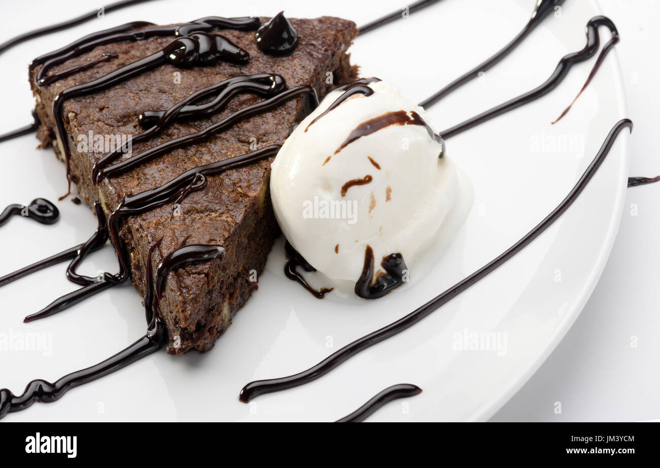 slice of cake brownie with ice cream on white plate Stock Photo - Alamy