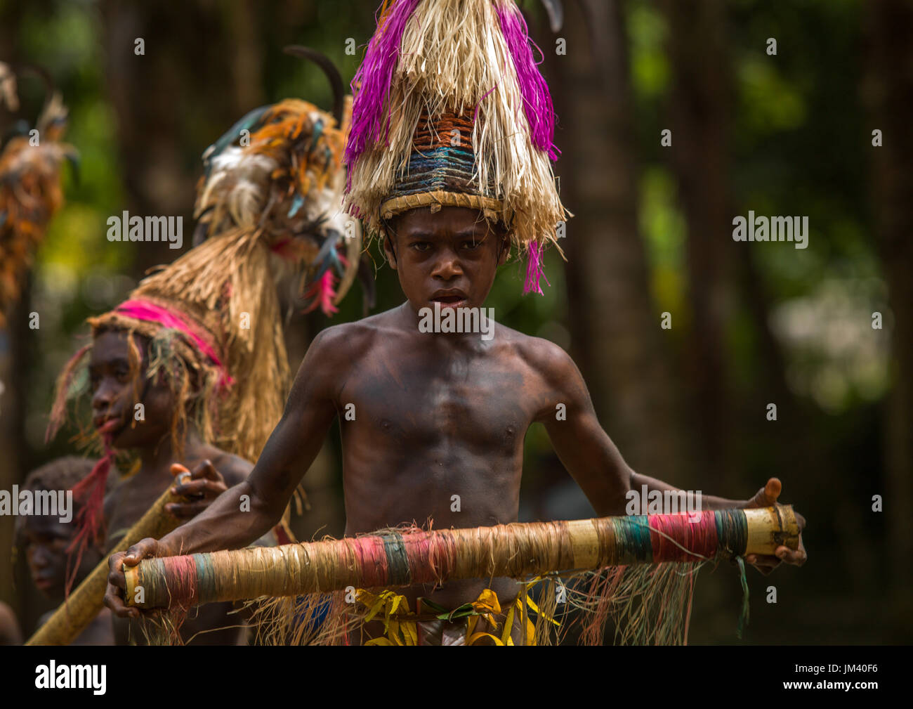 Small Nambas children with Big headdresses dancing during the palm tree dance, Malekula island, Gortiengser, Vanuatu Stock Photo