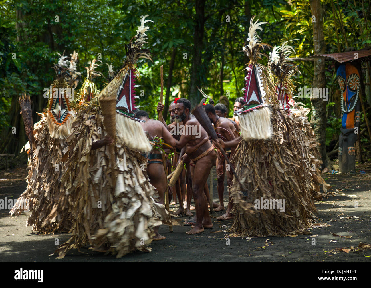 Rom dance masks and giant slit drum during a ceremony, Ambrym island ...