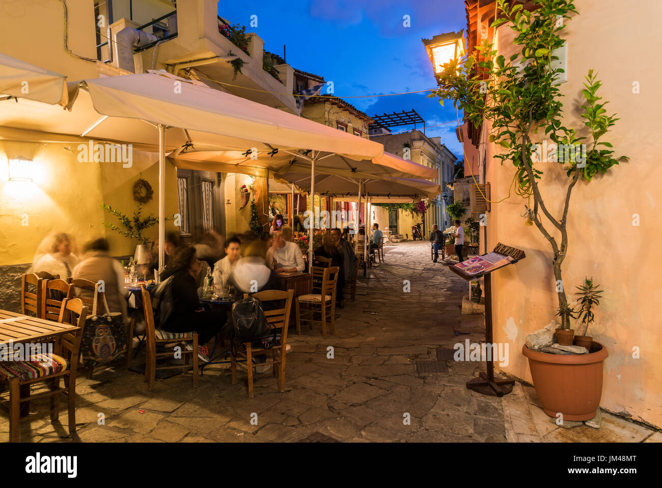 Night view of an outdoor cafe in the picturesque neighborhood of Anafiotika, Athens, Attica, Greece Stock Photo