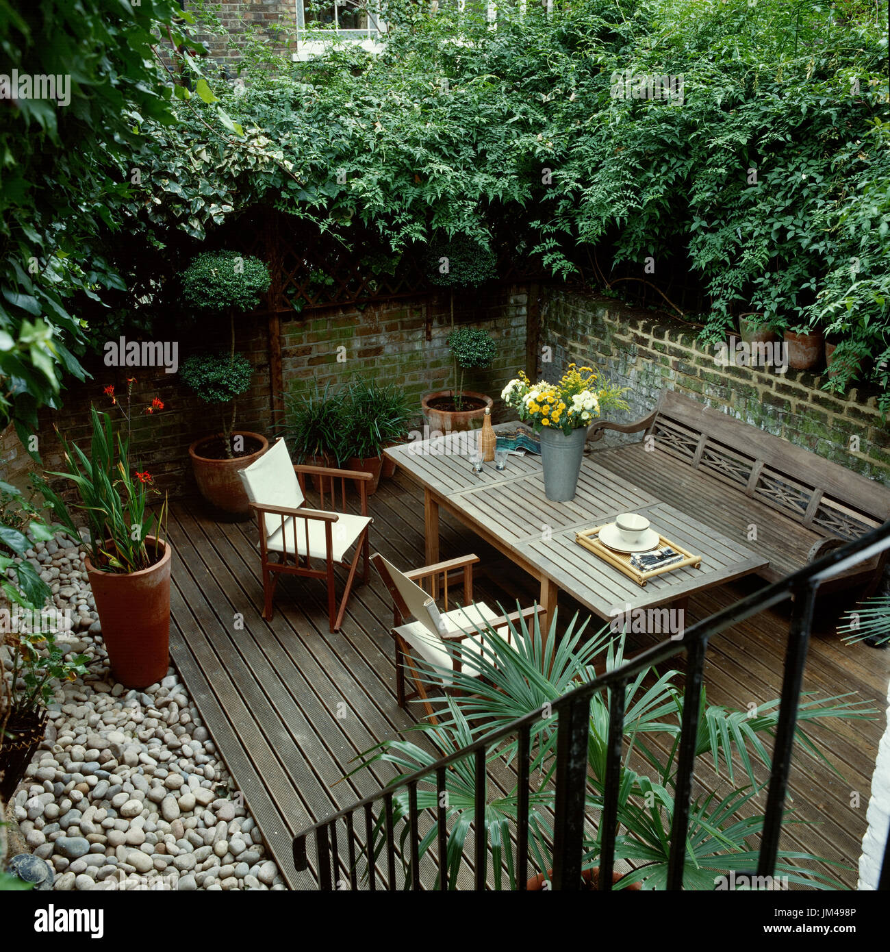 Outdoor table and chairs on deck Stock Photo Alamy
