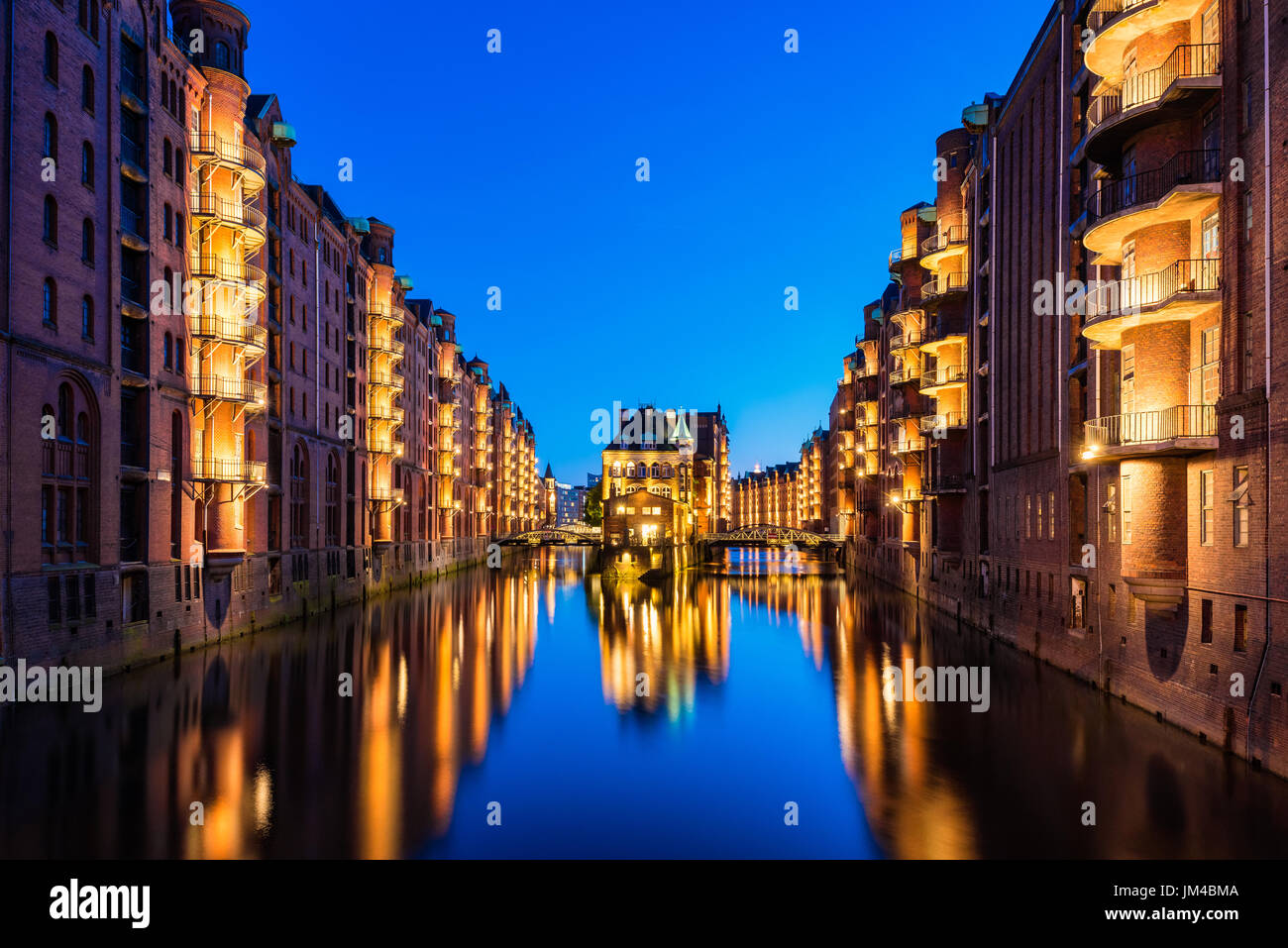 Canal Warehouses in Downtown District of Hamburg Germany at dusk Stock Photo