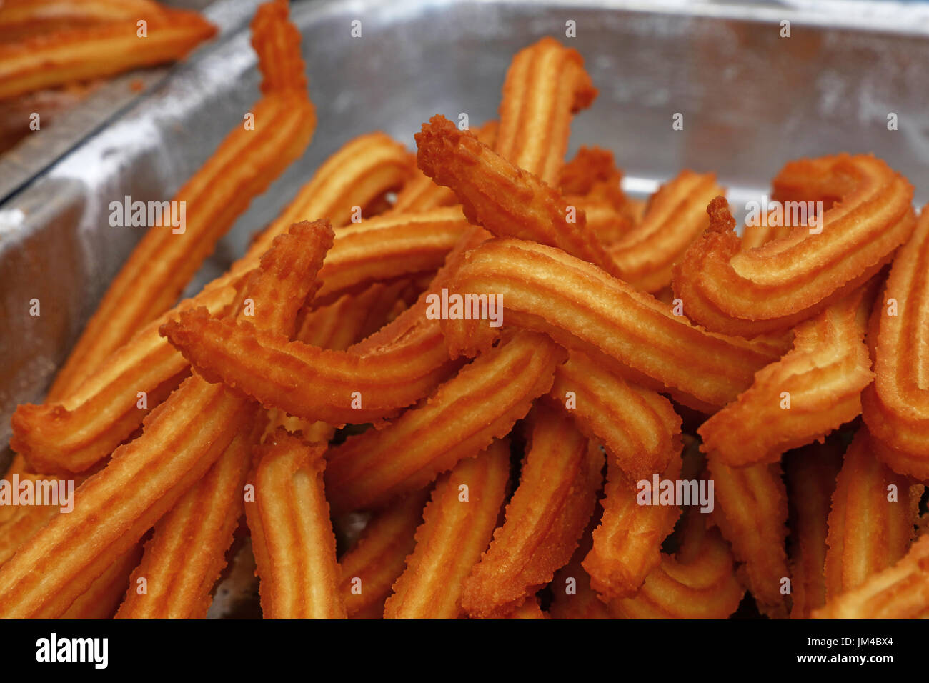 Sweet fresh churros, traditional Spanish or Portuguese deep fried dough