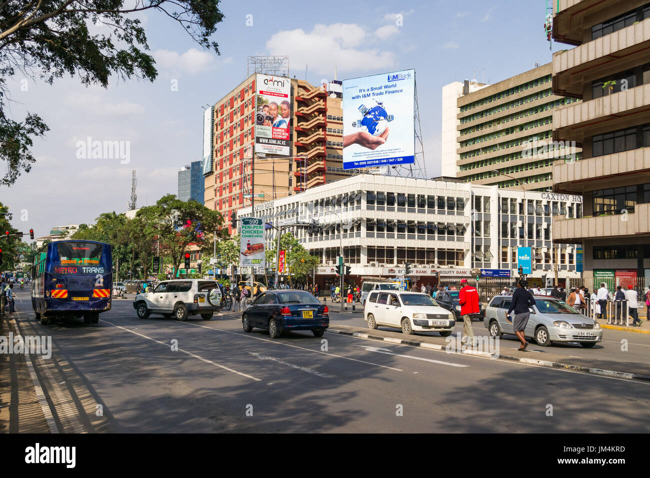 Vehicles Driving Through Market And Koinange Street Junction, Nairobi, Kenya Stock Photo