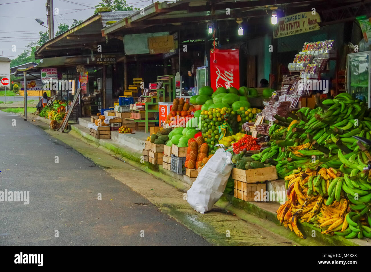 Esmeraldas, Ecuador - March 16, 2016: Delicious watermelons surrounded by other tropical fruits on the counter of the Latin America street market, Ecuador Stock Photo