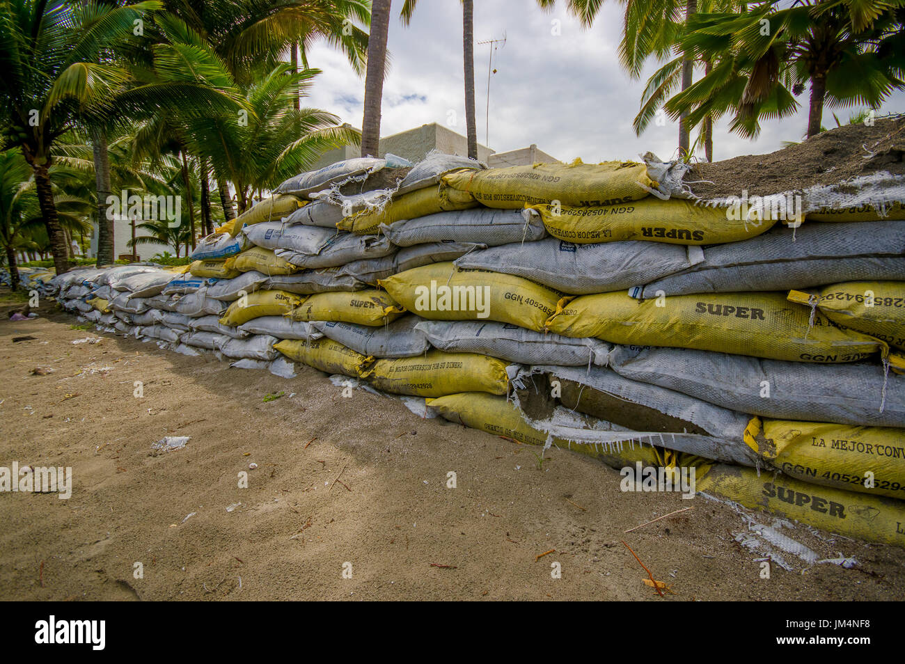 Esmeraldas, Ecuador - March 16, 2016: Sandbags to protect against the flood by tsunami in Same Beach, Casablanca Stock Photo
