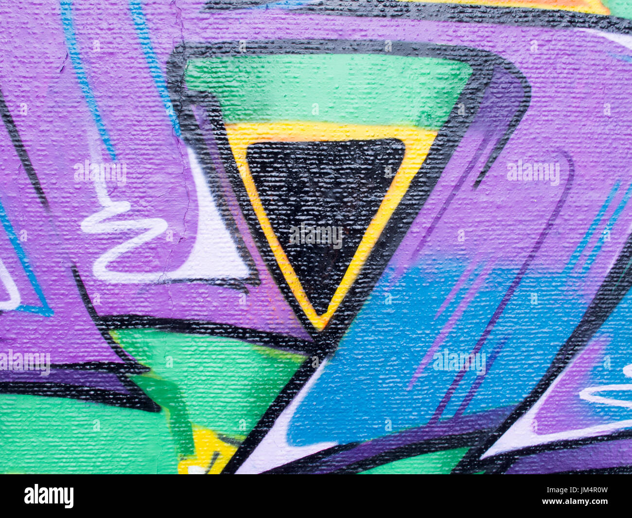 Details of grafiti with vivid colors on wall. Useful for backgrounds, backdrops and concept work. Stock Photo
