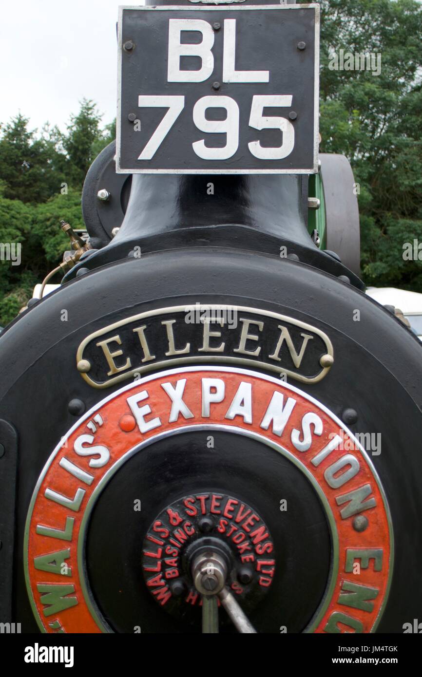 Circular orange nameplate and number plate on traction engine at Masham Steam Fair, Masham, North Yorkshire, UK Stock Photo