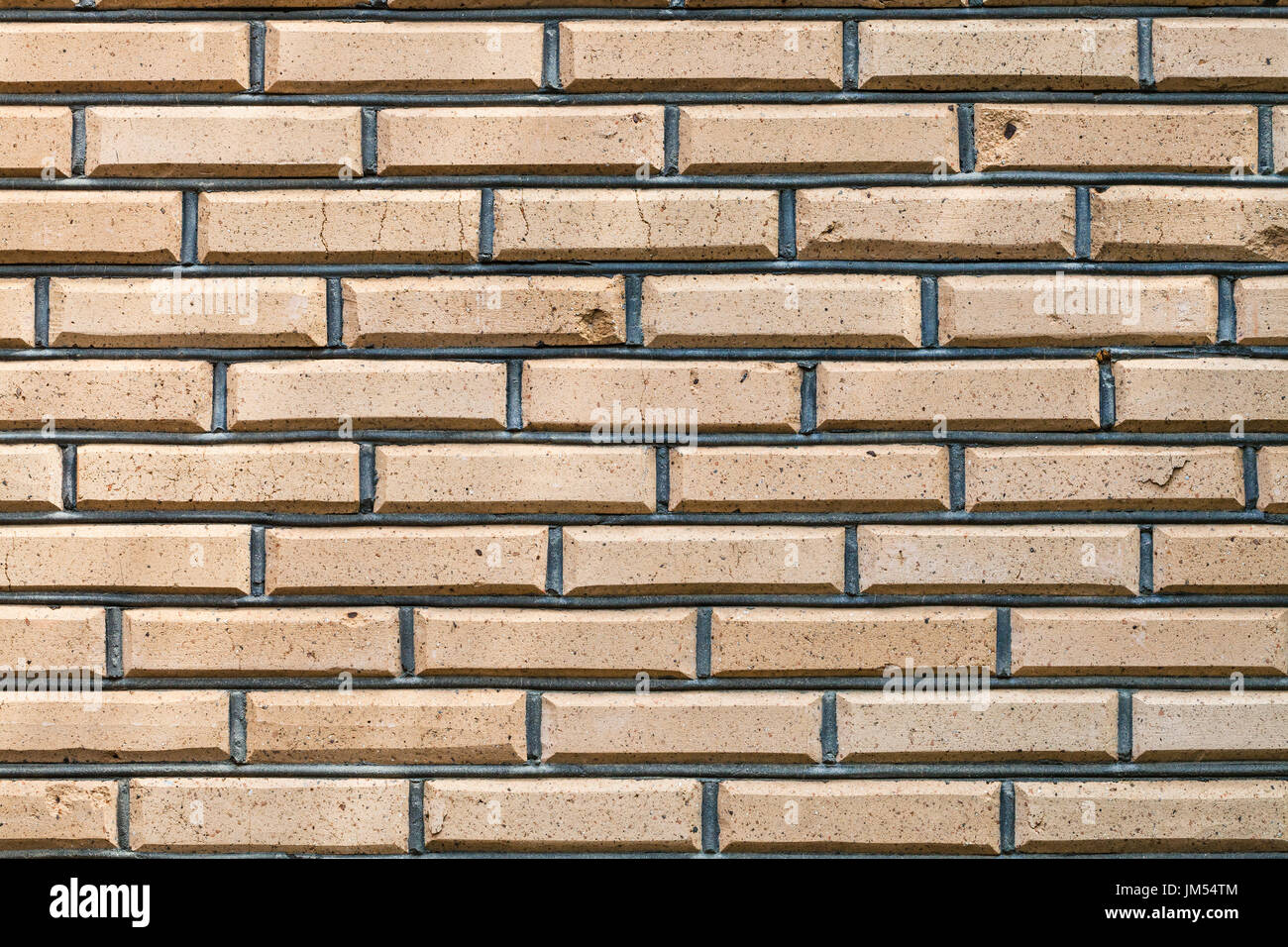 background from outdoor yellow brown brick wall Stock Photo