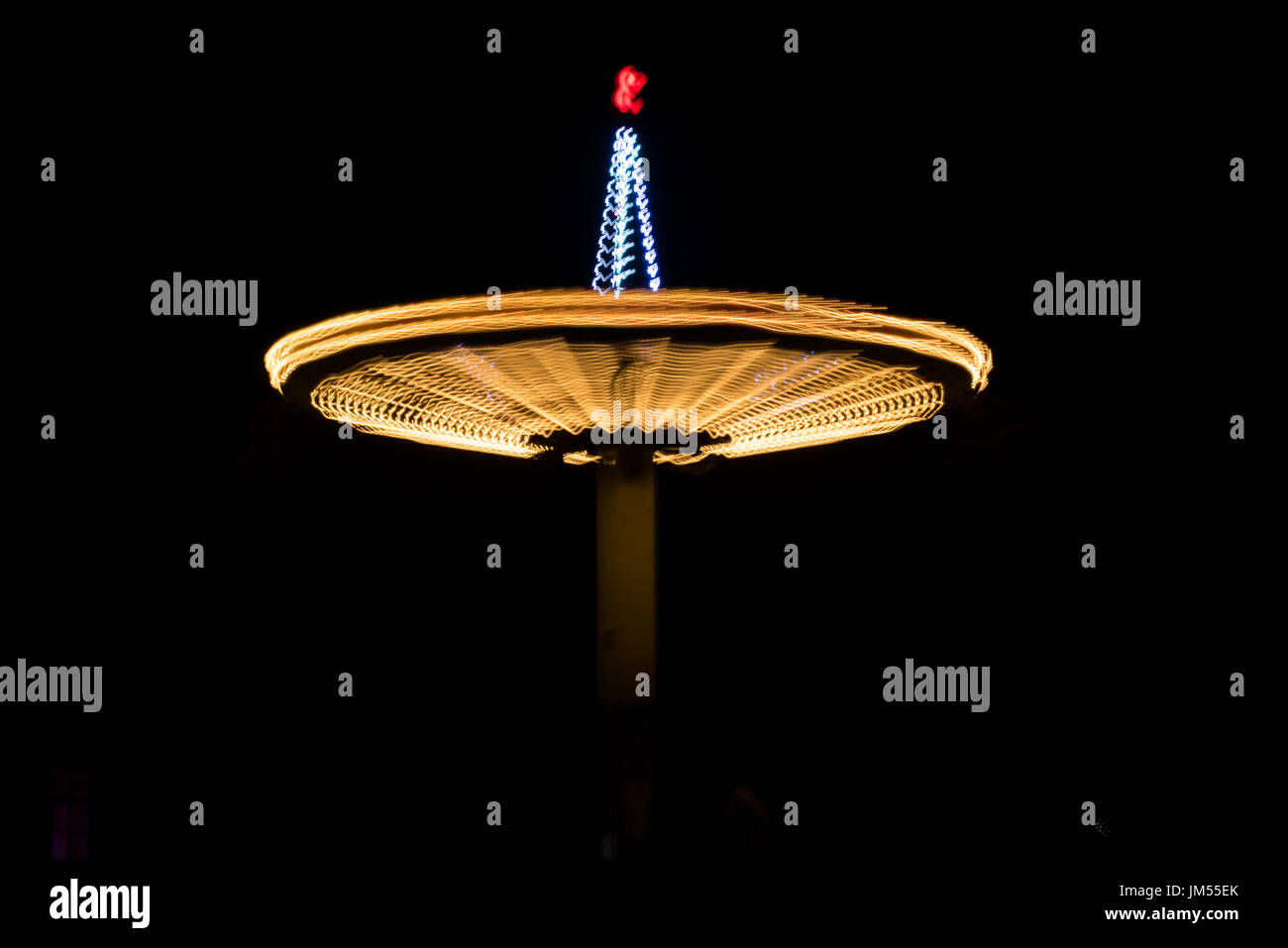 Blurred carousel photographed with long exposure technique at night