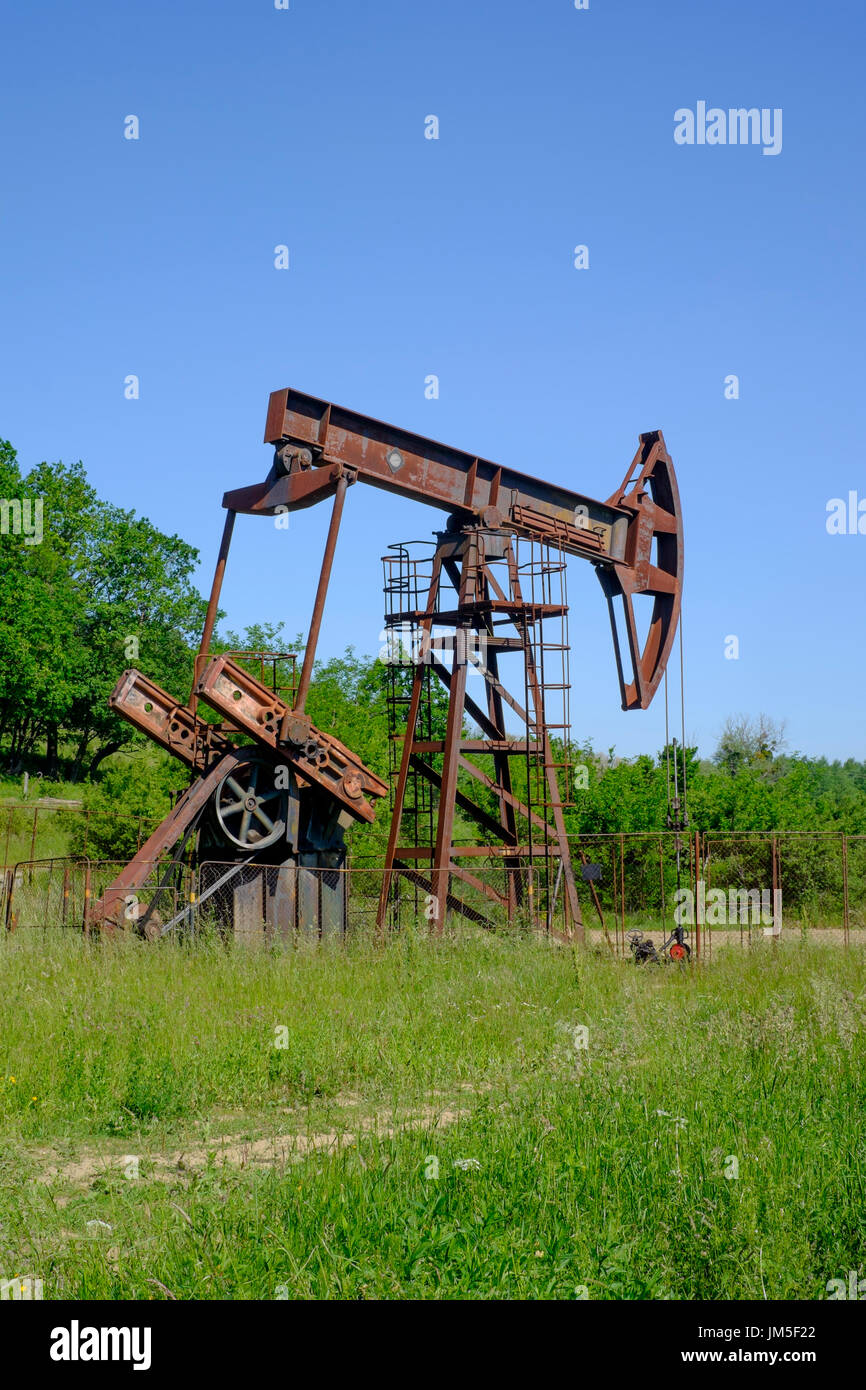 a nodding donkey pumpjack extracting oil in a rural location in zala