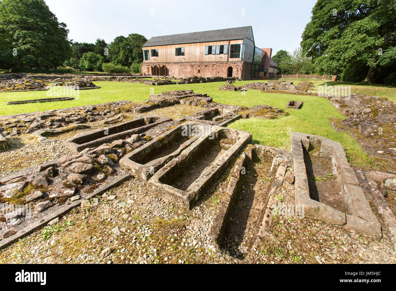 Norton Priory Museum & Gardens. Norton Priory ruins and burial grounds, with the undercroft in the background. Stock Photo