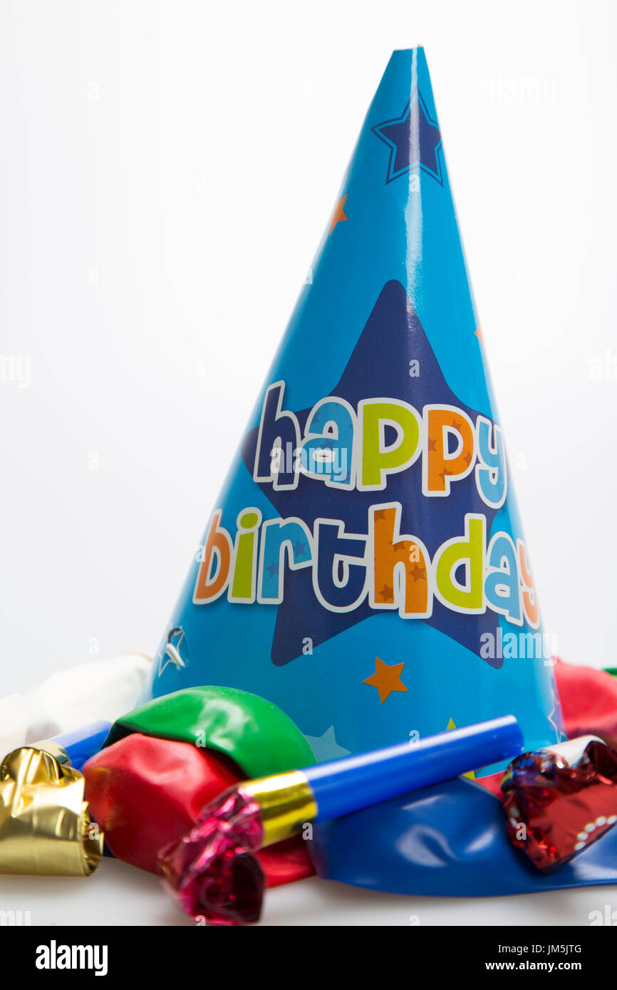 Blue party hat with balloons on white background Stock Photo - Alamy