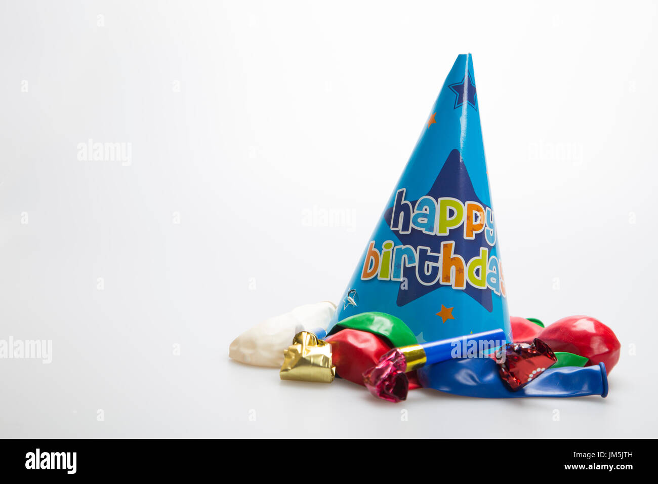 Party hat on white background with balloons and party blowers Stock ...