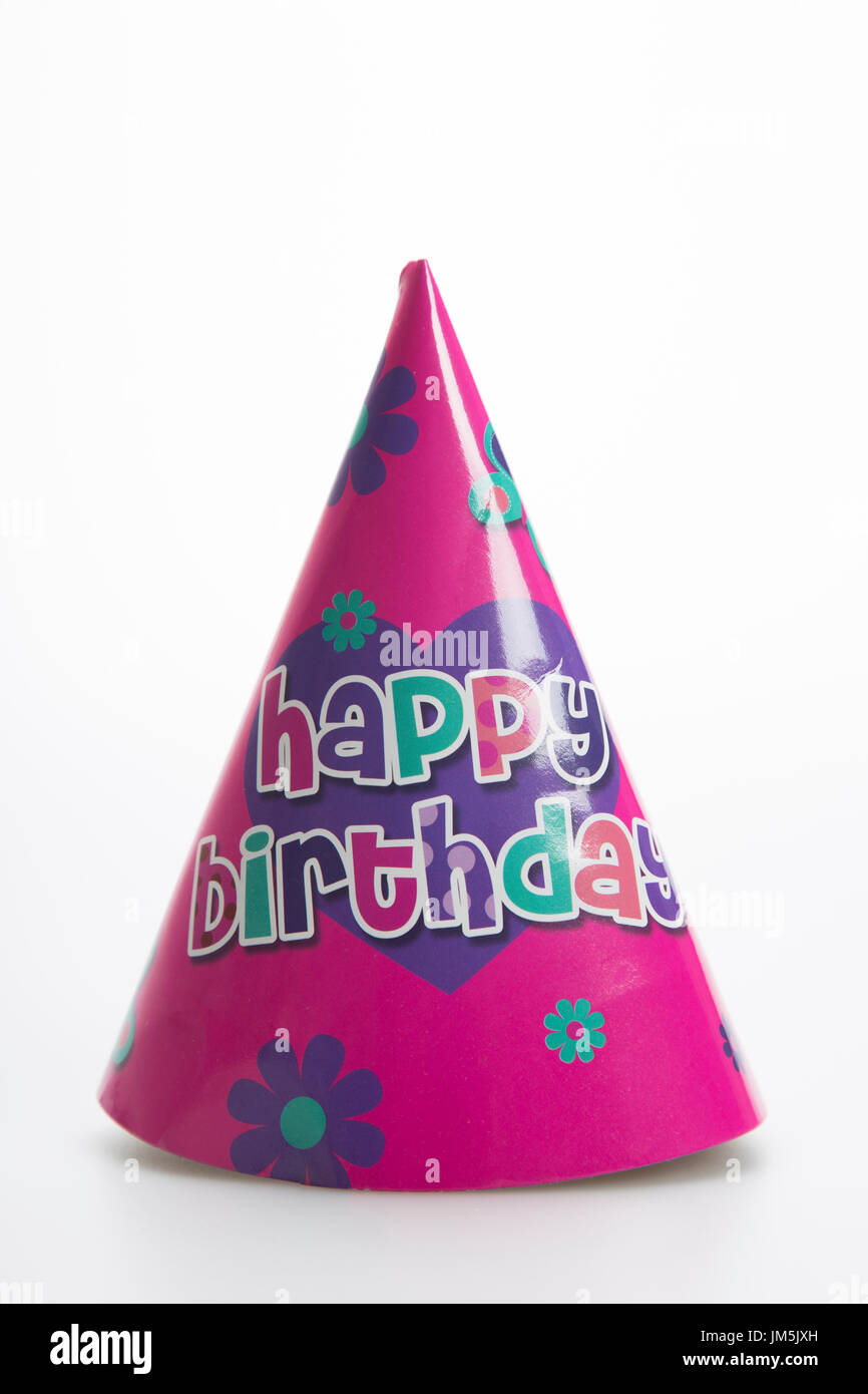 Pink birthday party hat on a white background Stock Photo - Alamy